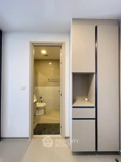 Modern bathroom with sleek cabinetry and neutral tones in a contemporary apartment.