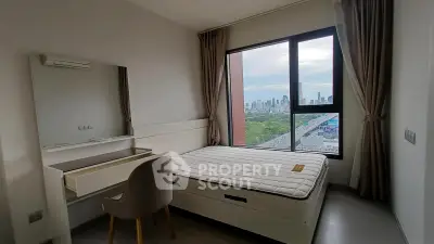 Modern bedroom with city view, featuring a comfortable bed and stylish furniture, perfect for urban living.