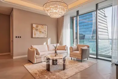 Luxurious living room with elegant chandelier and stunning city view