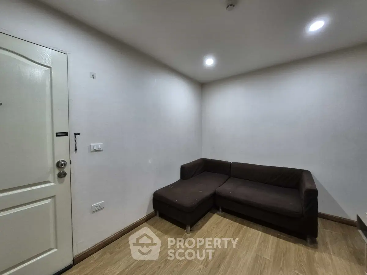 Cozy living room with modern sectional sofa and wooden flooring