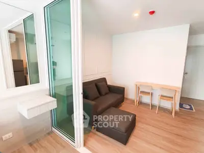 Modern living room with sleek design and cozy furniture in a stylish apartment.