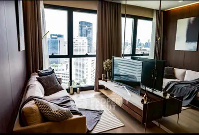 Luxurious living room with city view, modern decor, and cozy seating area.