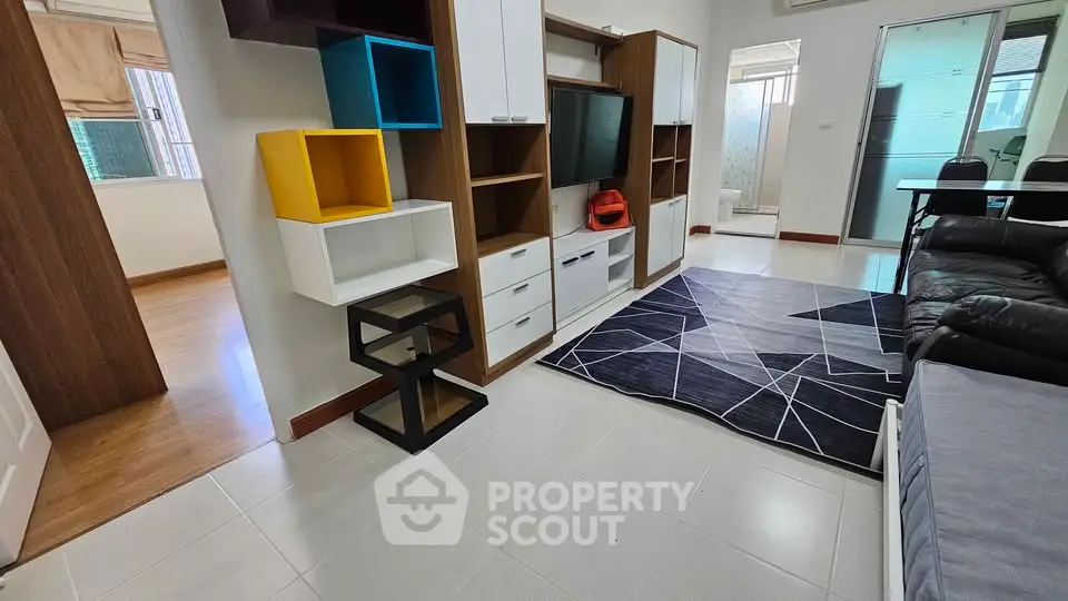 Modern living room with stylish shelving and sleek furniture