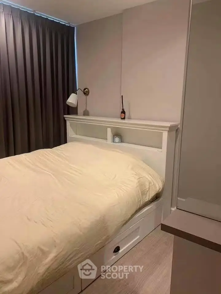 Cozy bedroom with modern decor and ample natural light, featuring a comfortable bed and stylish furnishings.