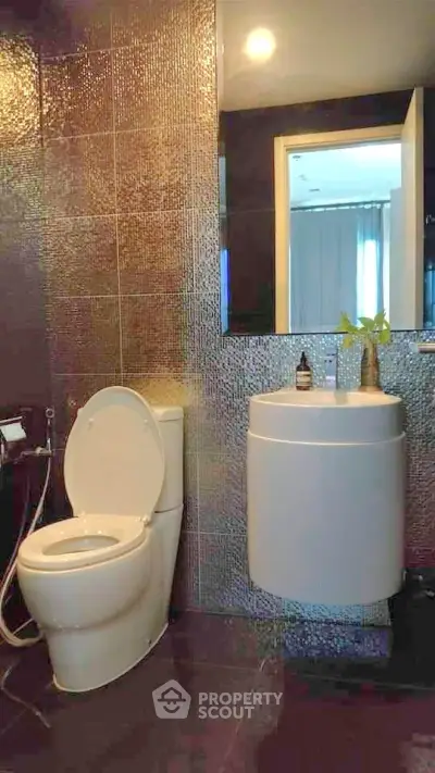 Modern bathroom with sleek fixtures and stylish tile design