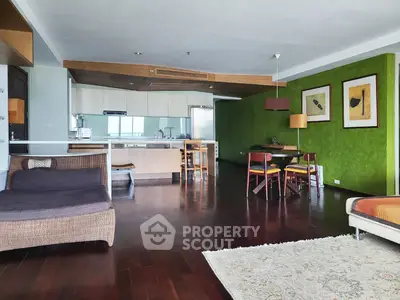 Spacious open-plan living room with modern kitchen and stylish decor