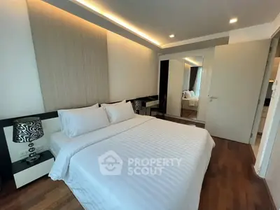 Modern bedroom with elegant decor and wooden flooring