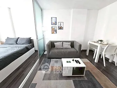 Modern studio apartment with cozy living area and stylish decor