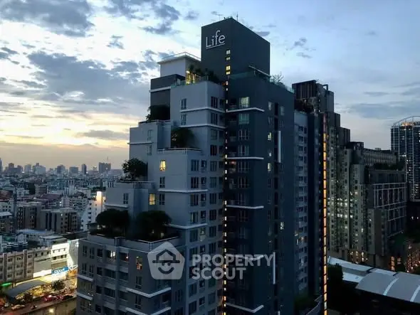 Stunning cityscape view of modern high-rise building at sunset.