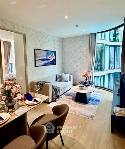 Luxurious modern living room with elegant decor and large curved windows