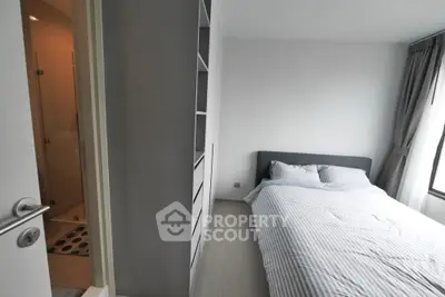 Modern minimalist bedroom with ensuite bathroom and natural light