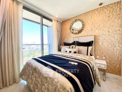 Luxurious bedroom with elegant decor and stunning city view from large window