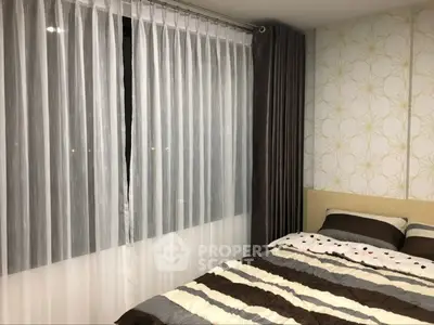 Cozy bedroom with modern decor and stylish curtains