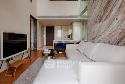 Modern living room with stylish decor and open kitchen layout