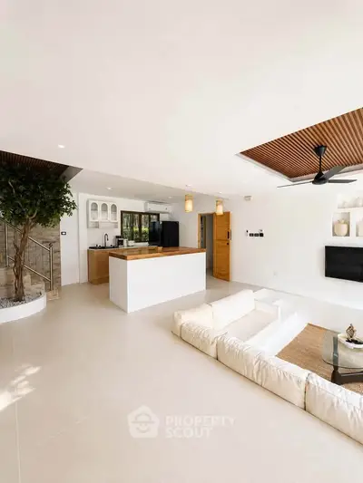Spacious modern living room with open kitchen and stylish decor