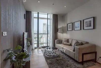 Modern living room with city view, stylish decor, and cozy seating area.