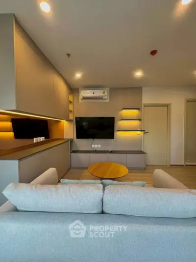 Modern living room with sleek design and ambient lighting