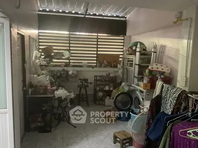 Cozy storage room with ample shelving and natural light, perfect for organizing household items.