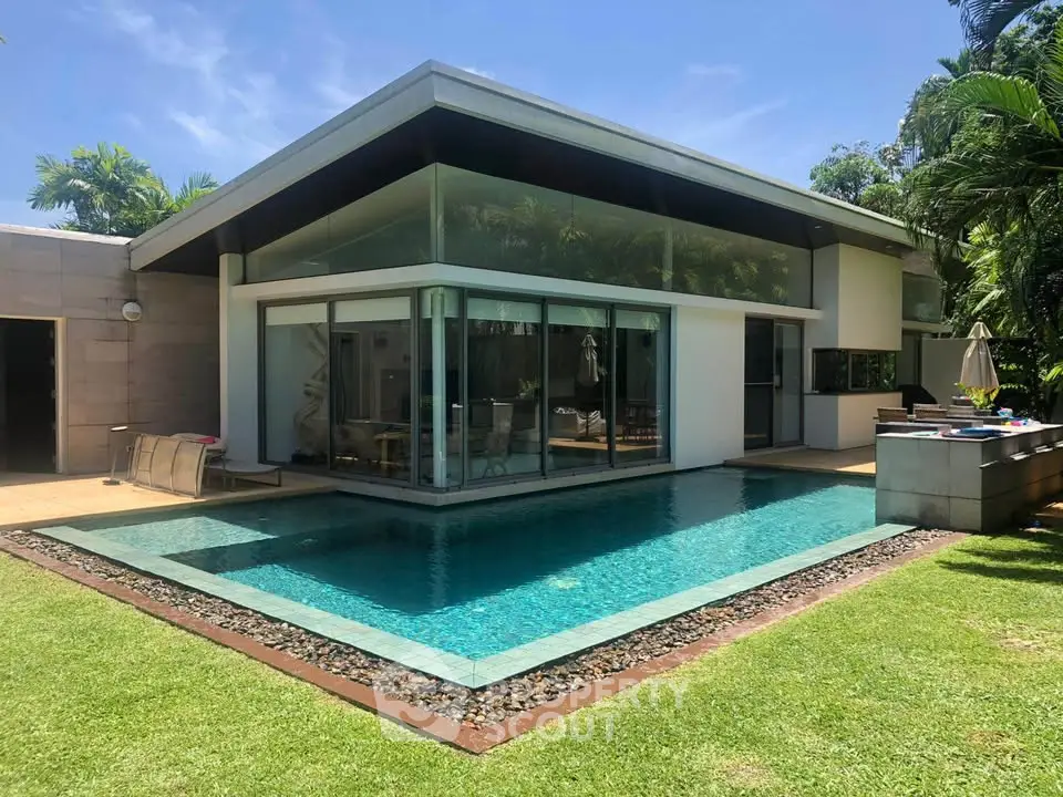 Luxurious modern villa with private pool and lush garden, perfect for serene living and entertaining.