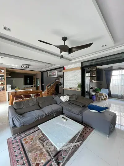 Spacious modern living room with open kitchen and stylish decor