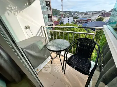 Charming balcony with city view, perfect for relaxing and enjoying the outdoors.