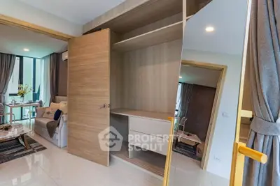 Spacious open-plan living room with modern furniture and built-in storage
