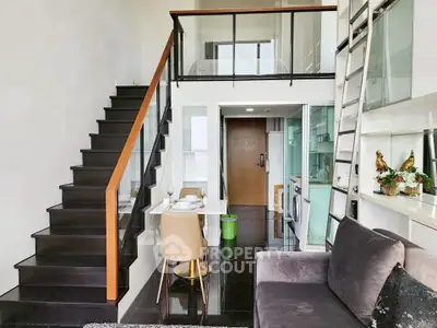 Modern duplex apartment with sleek staircase and stylish open kitchen layout