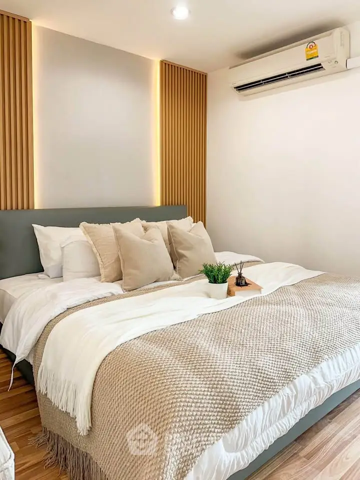 Cozy bedroom with modern decor and ambient lighting, featuring a comfortable bed and stylish accents.