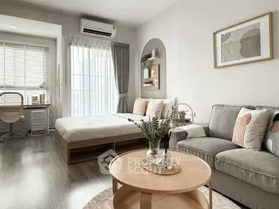 Modern studio apartment with cozy living area and stylish decor