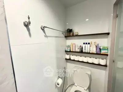 Modern bathroom with sleek shelving and ample storage space
