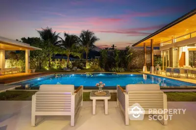 Luxurious modern villa with stunning pool and sunset view, perfect for relaxation and entertainment.