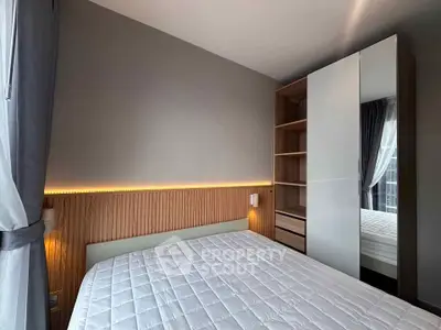 Modern bedroom with sleek wardrobe and ambient lighting