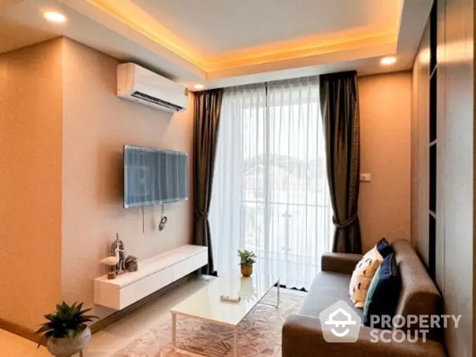 Elegant living room with ambient lighting, modern furniture, and plush sofa set, perfect for comfortable urban living.