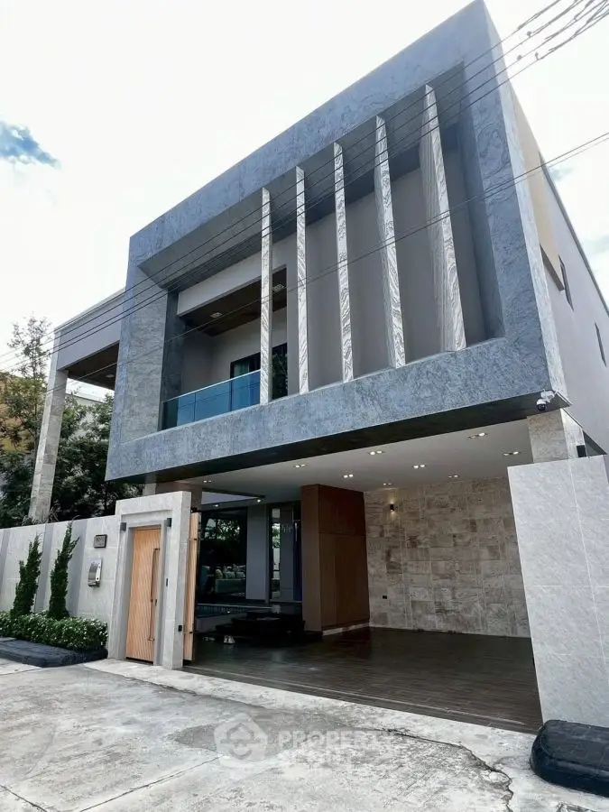 Modern architectural home with sleek facade and spacious driveway