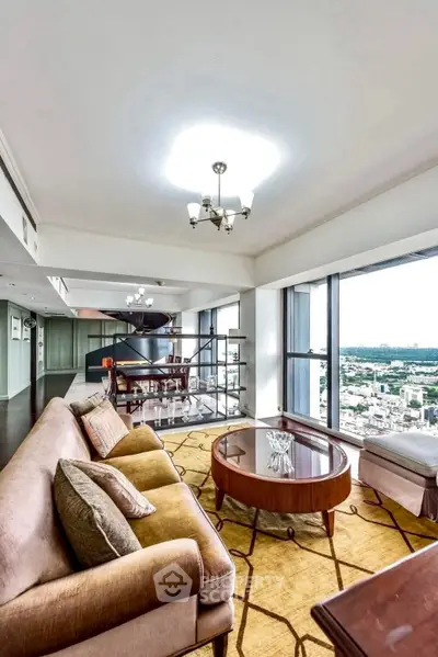 Luxurious high-rise living room with panoramic city views and elegant furnishings.