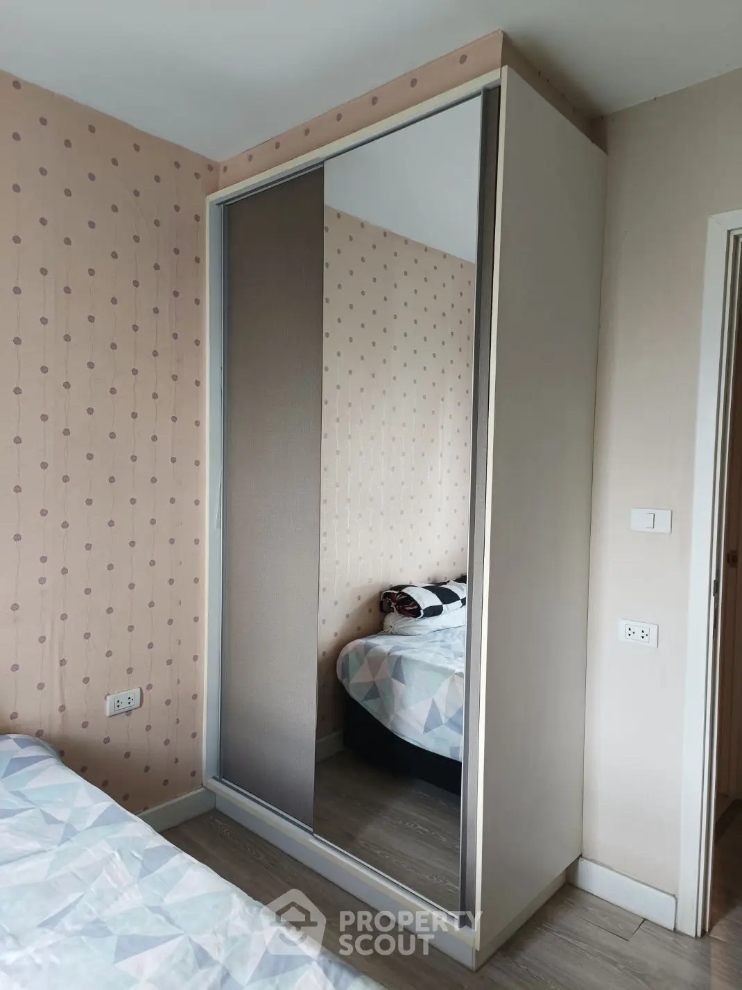 Cozy bedroom with modern wardrobe and stylish decor