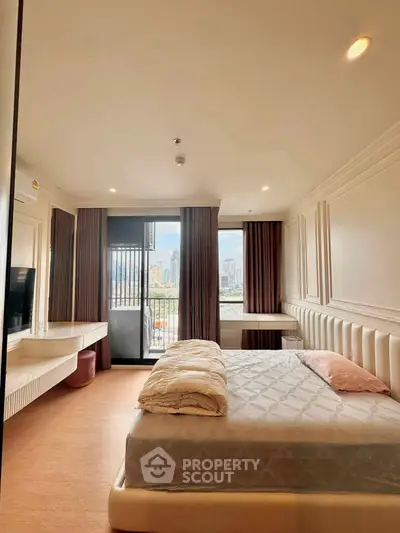 Luxurious bedroom with city view and elegant decor, featuring a cozy bed and stylish furnishings.