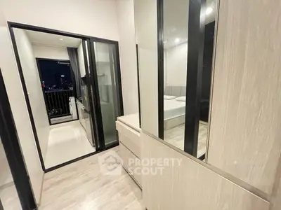 Modern apartment interior with sleek bedroom and balcony view