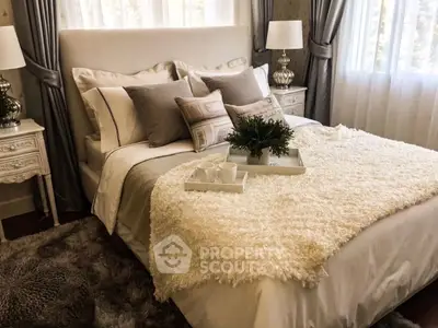 Luxurious bedroom with elegant decor and plush bedding, perfect for relaxation.