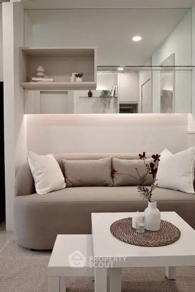 Modern living room with stylish beige sofa and elegant decor