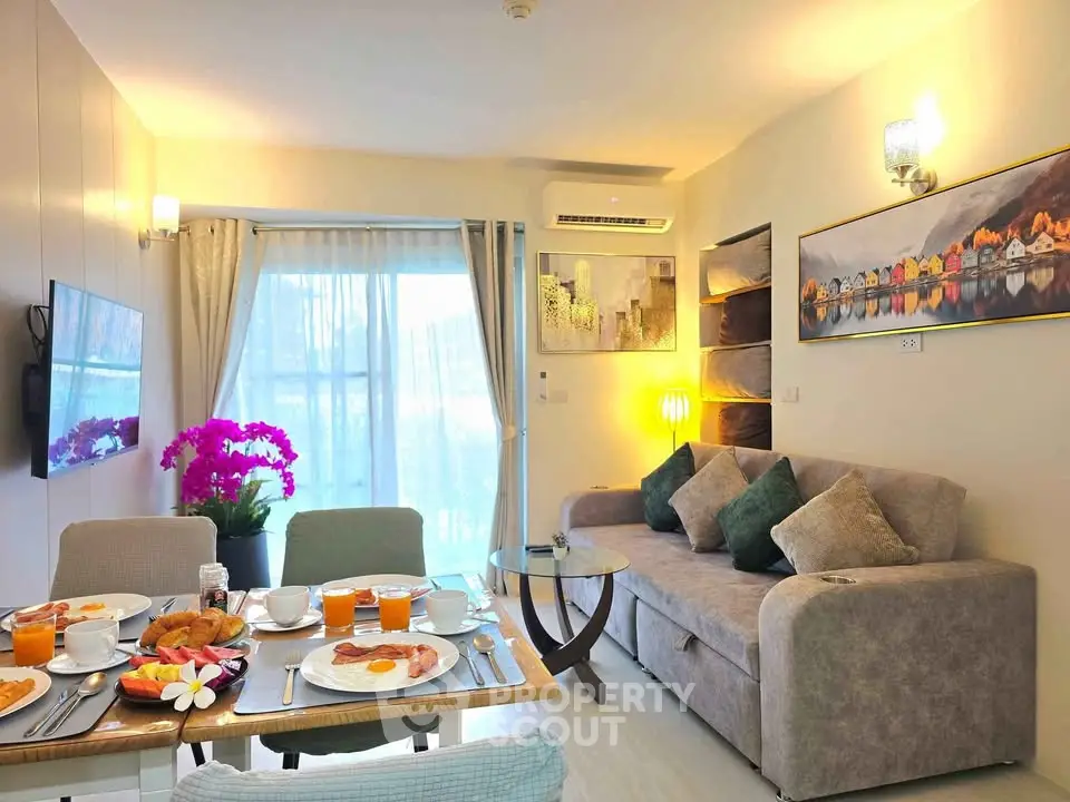 Stylish living room with modern decor and dining setup, perfect for cozy gatherings.