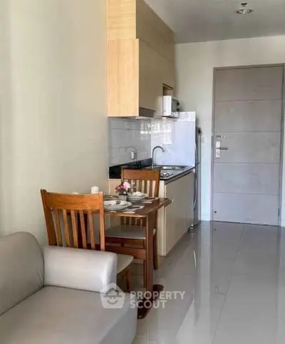 Cozy apartment kitchen with dining area and modern appliances