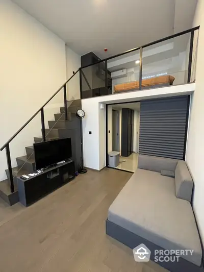 Modern loft apartment with mezzanine bedroom and sleek living area