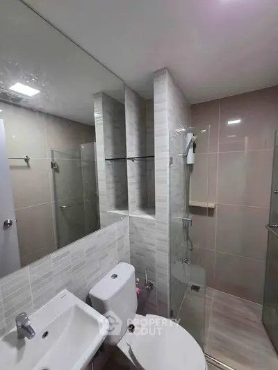 Modern bathroom with sleek design and glass shower enclosure
