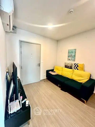 Cozy living room with modern decor and vibrant yellow sofa