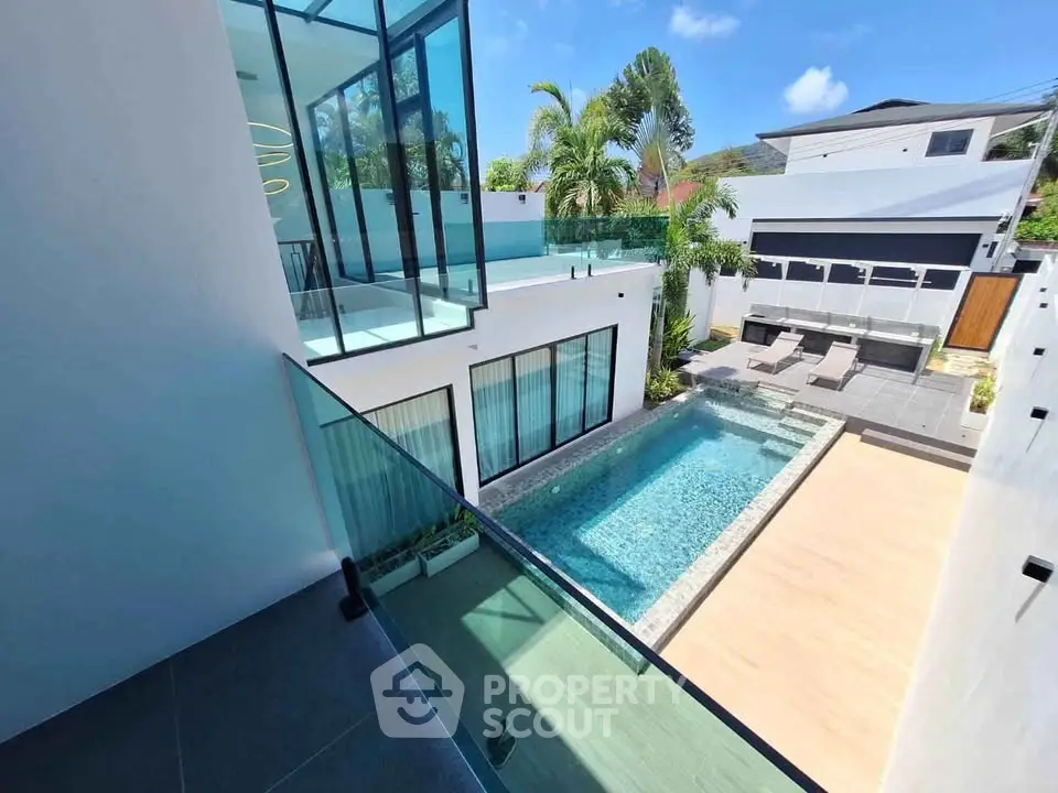 Luxurious modern villa with private pool and spacious balcony, perfect for tropical living.