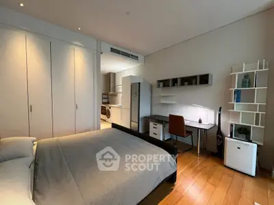 Modern bedroom with study area and sleek design in a stylish apartment.