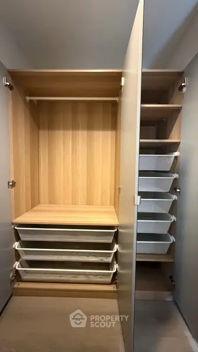 Spacious modern wardrobe with multiple storage compartments and sleek design.