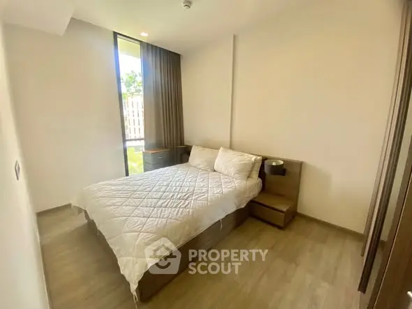 Modern bedroom with natural light and minimalist design