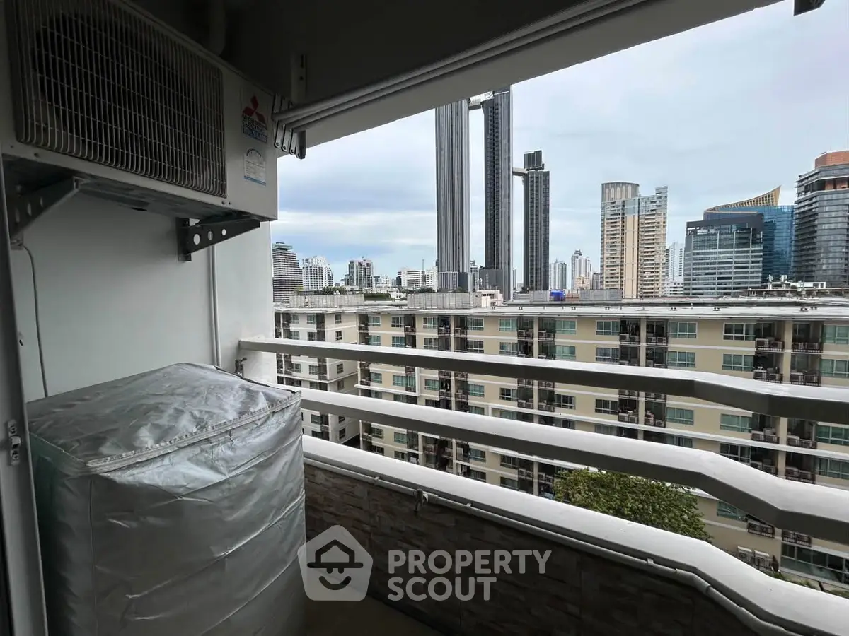 Stunning cityscape view from a modern apartment balcony with skyline backdrop.